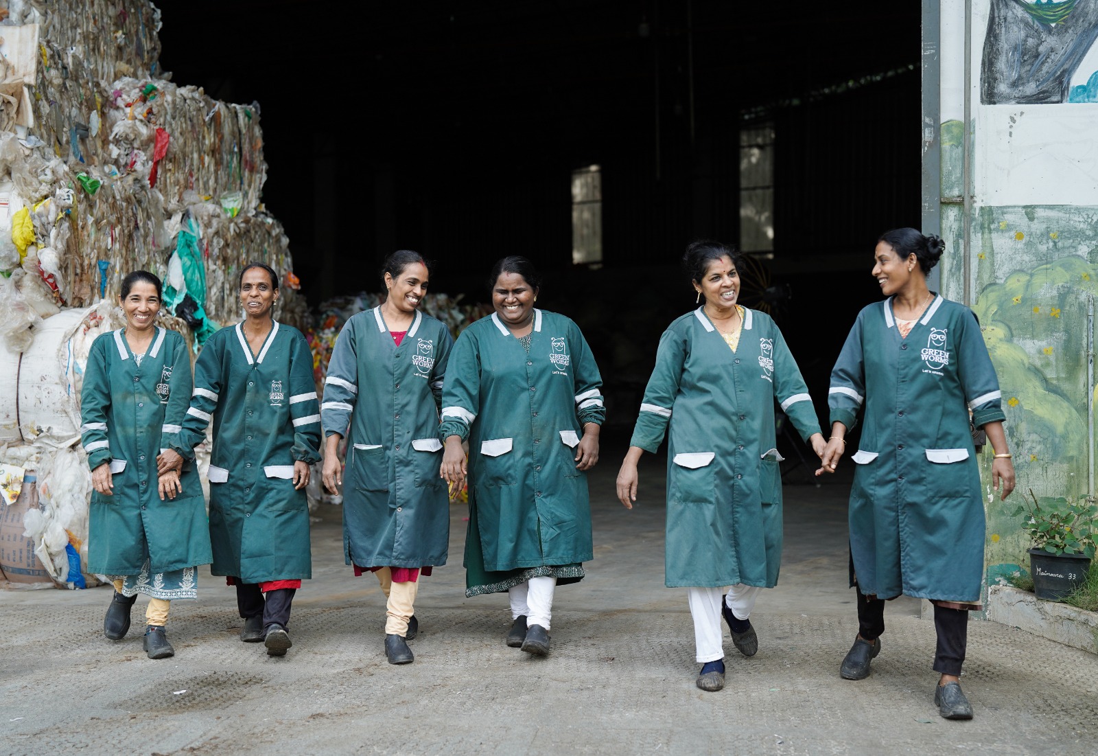 Women team members walking together at Green Worms